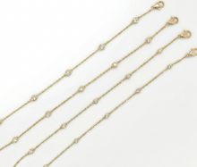 Load image into Gallery viewer, Diamonds by the Yard Bracelet With 5 Bezel Round Brilliant Diamonds set in 14K Yellow Gold
